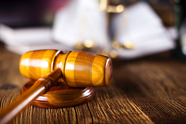 istock Wooden gavel and books 187782149