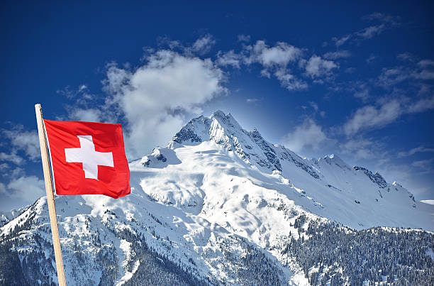 istock Swiss flag and snow mountain 187782274