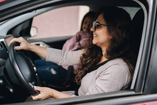 istock Mature woman driving car 1877833271