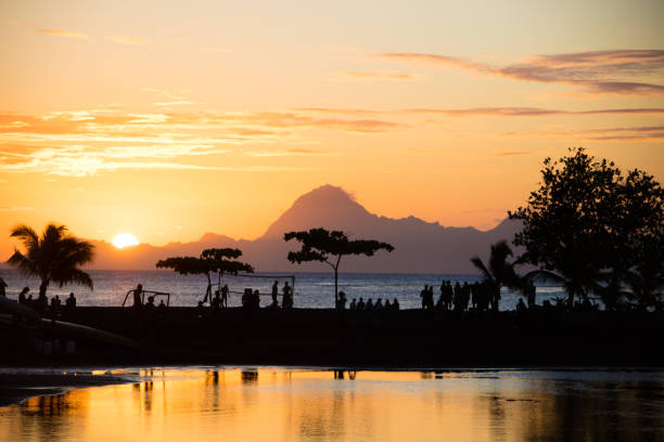 Sunset at Point venus on Tahiti, French Polynesia. Island of Moorea in the back.