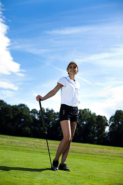 istock Girl playing golf on grass in summer 187785060