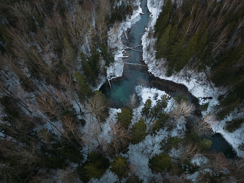 Nature of Estonia in winter. Local landmark Siniallikad in the forest, photo from a drone. High quality photo