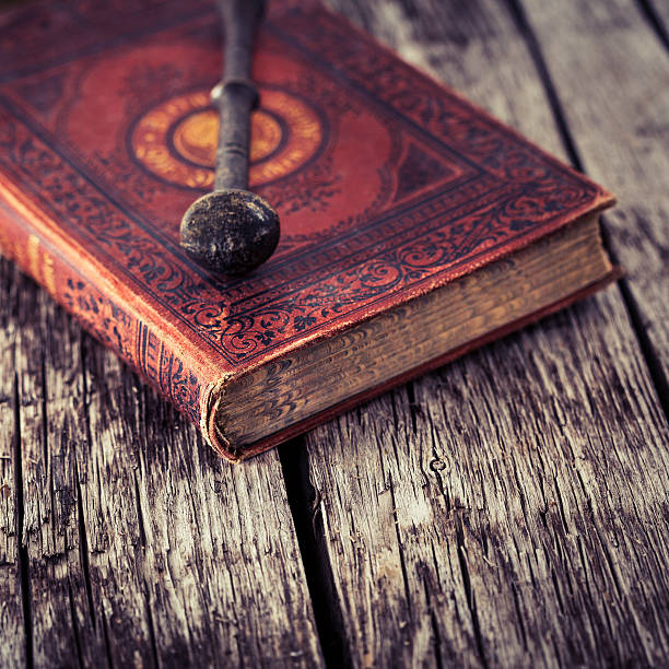 istock Antique book and pestle on wooden board 187786290