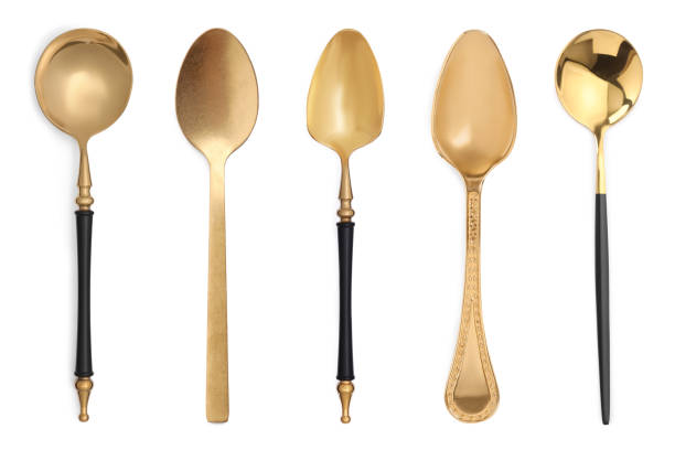 istock Different stylish golden spoons on white background 1877877237