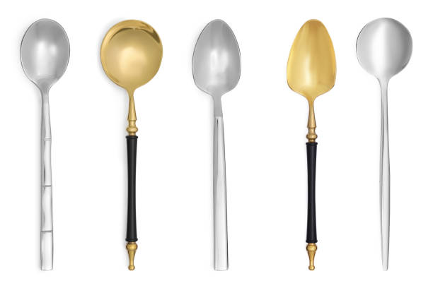 istock Stylish golden and silver spoons on white background 1877877765