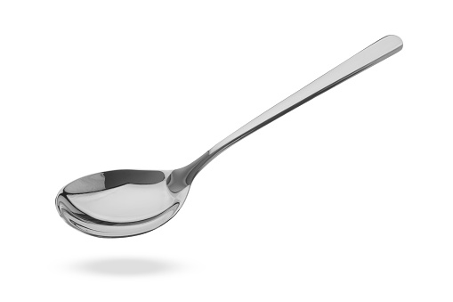 Silver spoon in air isolated on white