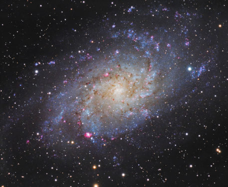 Triangulum (or Pinwheel or Messier 33) galaxy is one of the closest galaxies to our Milky Way. With distance of 2.7 million light years and 40 billion stars is very popular object in astronomy. Photographed with high quality astronomical telescope and long exposure. Processed in professional astronomical software. It can be easy flipped, rotated and maintain visual quality.