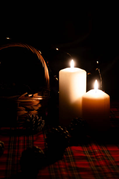 istock Christmas candles on plaid fabric 1877881453