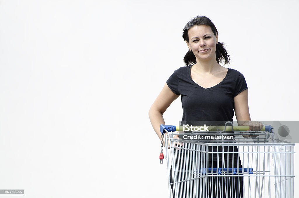 Shopping cart Woman with a shopping cart and white background One Woman Only Stock Photo