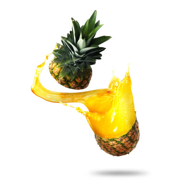 istock Pineapple with splashing juice isolated on white 1877896389