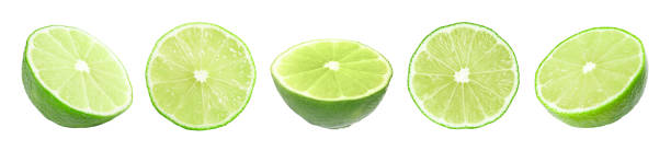 istock Cut limes isolated on white, set. Citrus fruit 1877897440