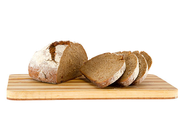 istock loaf of bread on a wooden board 187790623