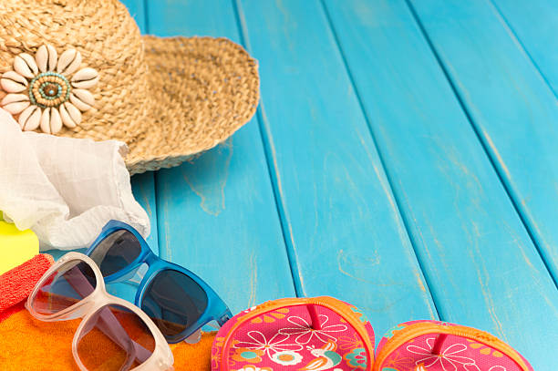 istock Beach scene with hat, thongs and blue wood decking 187791250