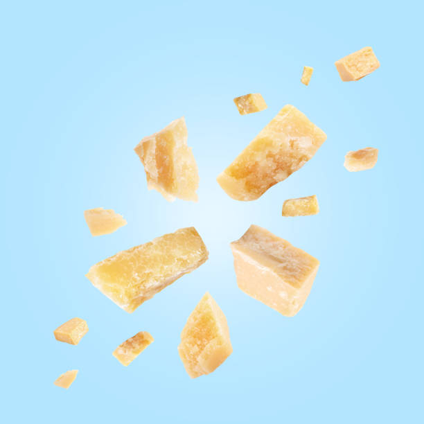 istock Parmesan cheese in air on light blue background 1877917030
