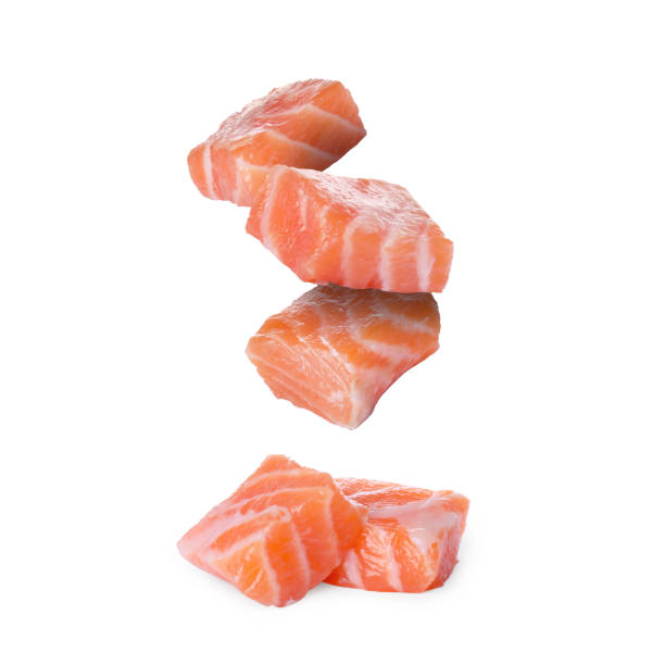 istock Pieces of salmon falling on white background 1877917566