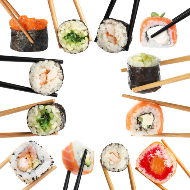 Different sushi isolated on white. Chopsticks with asian food, set