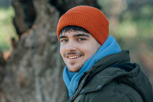 young man bundled up in winter outdoors