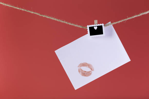 istock White paper with kiss and heart. 1877930490
