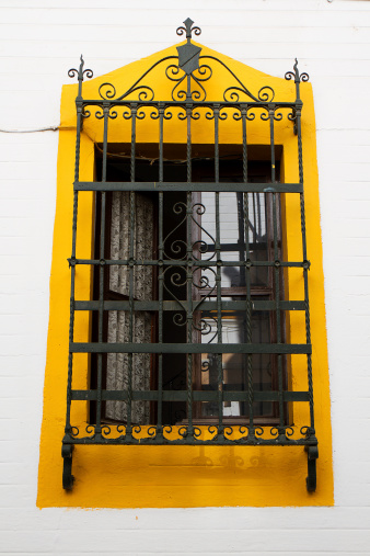 This is a tipical andalucian window on a white wall.