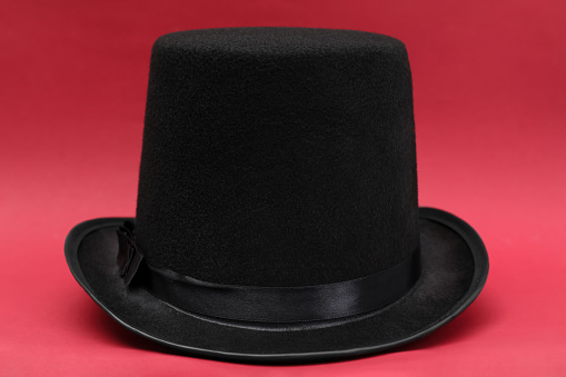 One magician top hat on red background