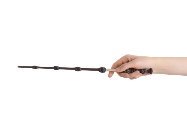 istock Woman holding magic wand on white background, closeup 1877973191