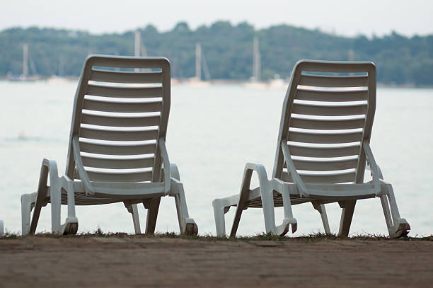 istock lounger by the sea 187800138