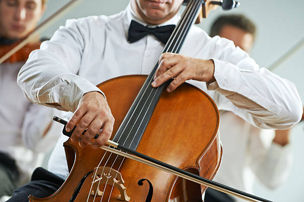 istock Man playing a cello in an orchestra  187800253