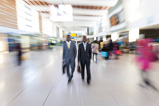 istock African businessman at the train station, motion blur. 187801570
