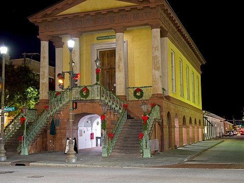 Charleston, South Carolina - USA, November 30, 2023.  The Museum at Market Hall at night in downtown Charleston South Carolina. Greek Revival landmark built in 1841 offering Civil War history & tours