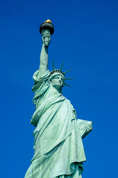 istock Satue of Liberty on blue sky 187804719