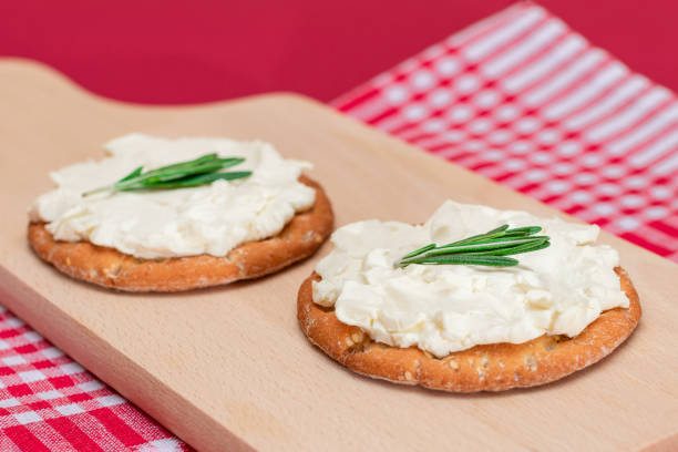 istock Crispy Cracker Sandwich with Cream Cheese and Rosemary 1878060778