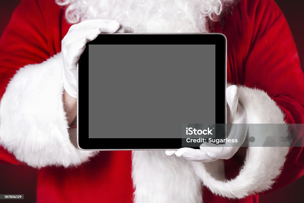 Santa holding a tablet with blank space Digitally Generated Image Stock Photo