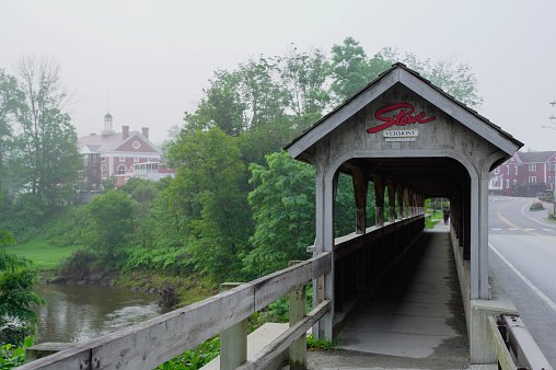 Stowe, Vermont,USA-July 27, 2023-  town of Stowe in Vermont in the summer，Covered wooden pedestrian bridge in Stowe