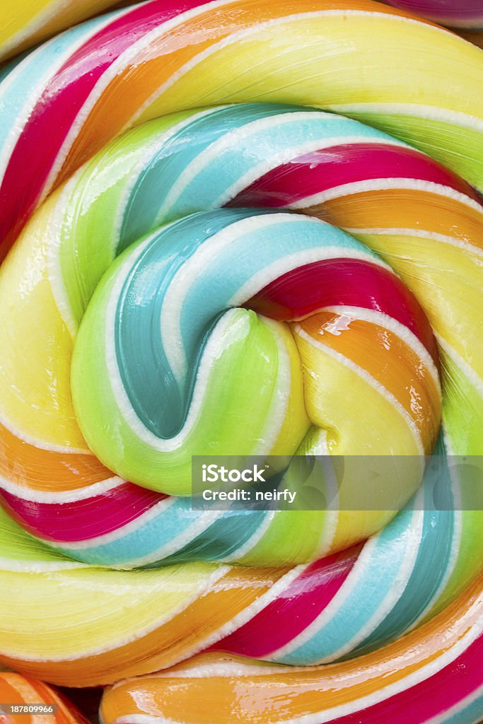striped spiral candy close up bakcground of striped spiral multicolored candy close up Backgrounds Stock Photo