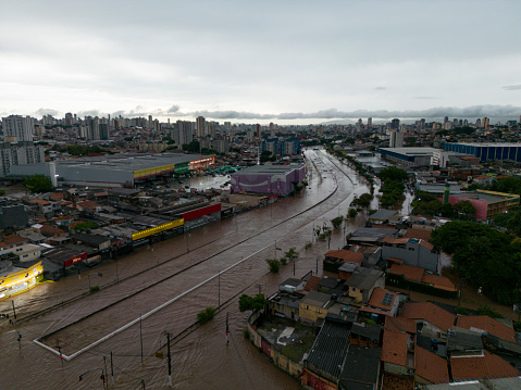 São Paulo, SP, Brazil - December 23, 2023: Flooding caused by the overflow of the Aricanduva stream in the eastern region of the city. Floods in the city are common during the summer and are increasing in frequency with climate change