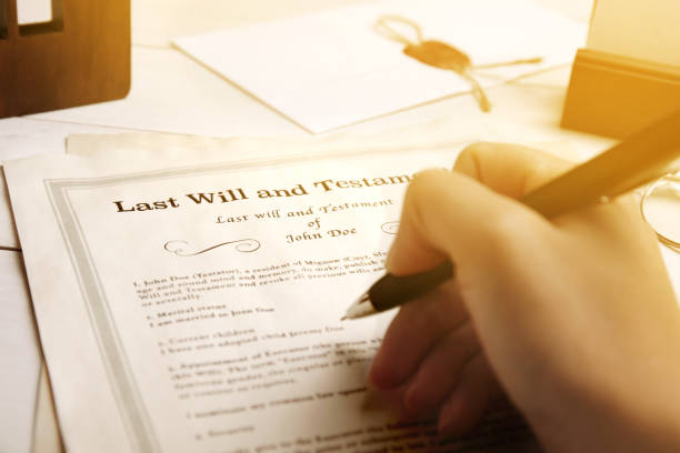 istock Woman reading Last Will and Testament at table, closeup 1878127690