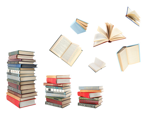 Books flying over stacks on white background