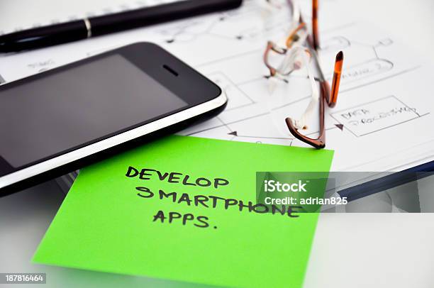 Picture Of A Sticky Note Reading Develop Smart Phone Apps Stock Photo - Download Image Now