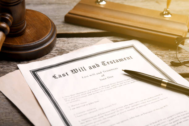 istock Last Will and Testament, pen and gavel on wooden table, closeup 1878171984