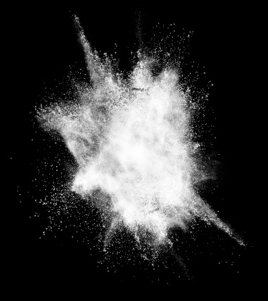 Design element, exploding white powder over black background. Real element.