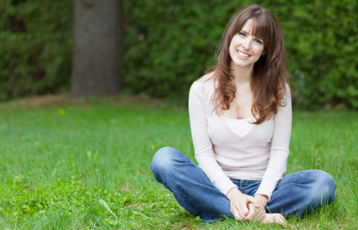 Portrait Of A Serene Woman Relaxing At The Park
