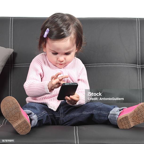 Cute Baby Browsing In A Smartphone Stock Photo - Download Image Now - Adversity, Baby - Human Age, Baby Girls