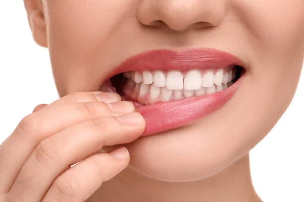 istock Woman showing her clean teeth on white background, closeup 1878218576