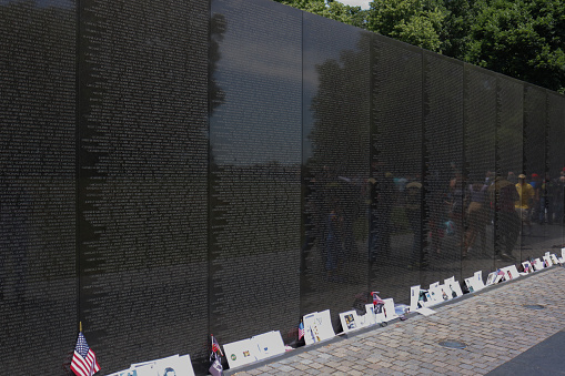 Washington D.C., USA - September 23, 2012: Vietnam Veterans War Memorial with the Washington Monument on the National Mall.