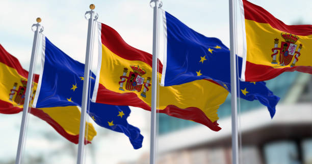 istock Spanish and European Union flags waving in the wind 1878244432