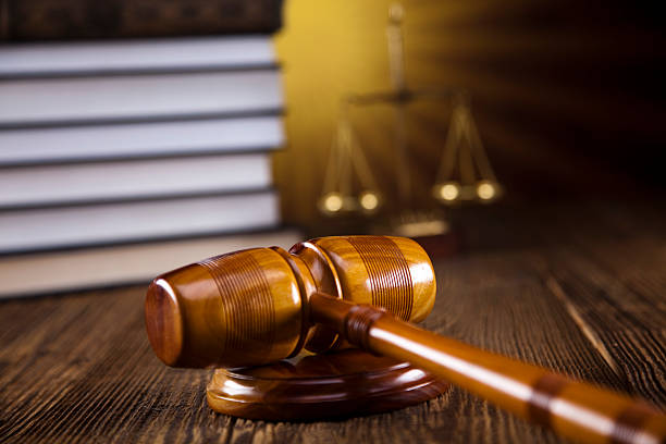 istock Wooden gavel and books 187825790