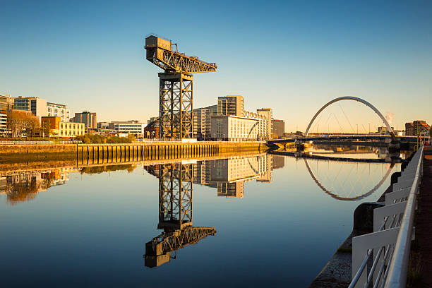 Evening winter light on the Finniestone Crane and Finnieston Bridge on the River Clyde, Glasgow.