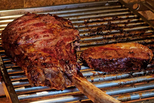 istock Tomahawk and chorizo on the barbecue grill 1878295160