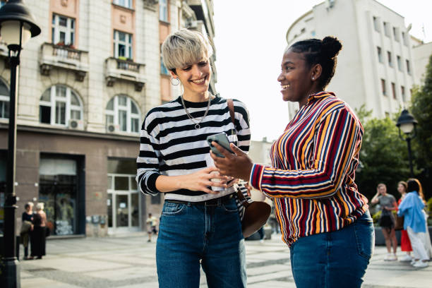 istock Two happy young women are having fun outside 1878346676