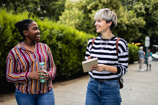 istock Two female students are walking around the city 1878346722